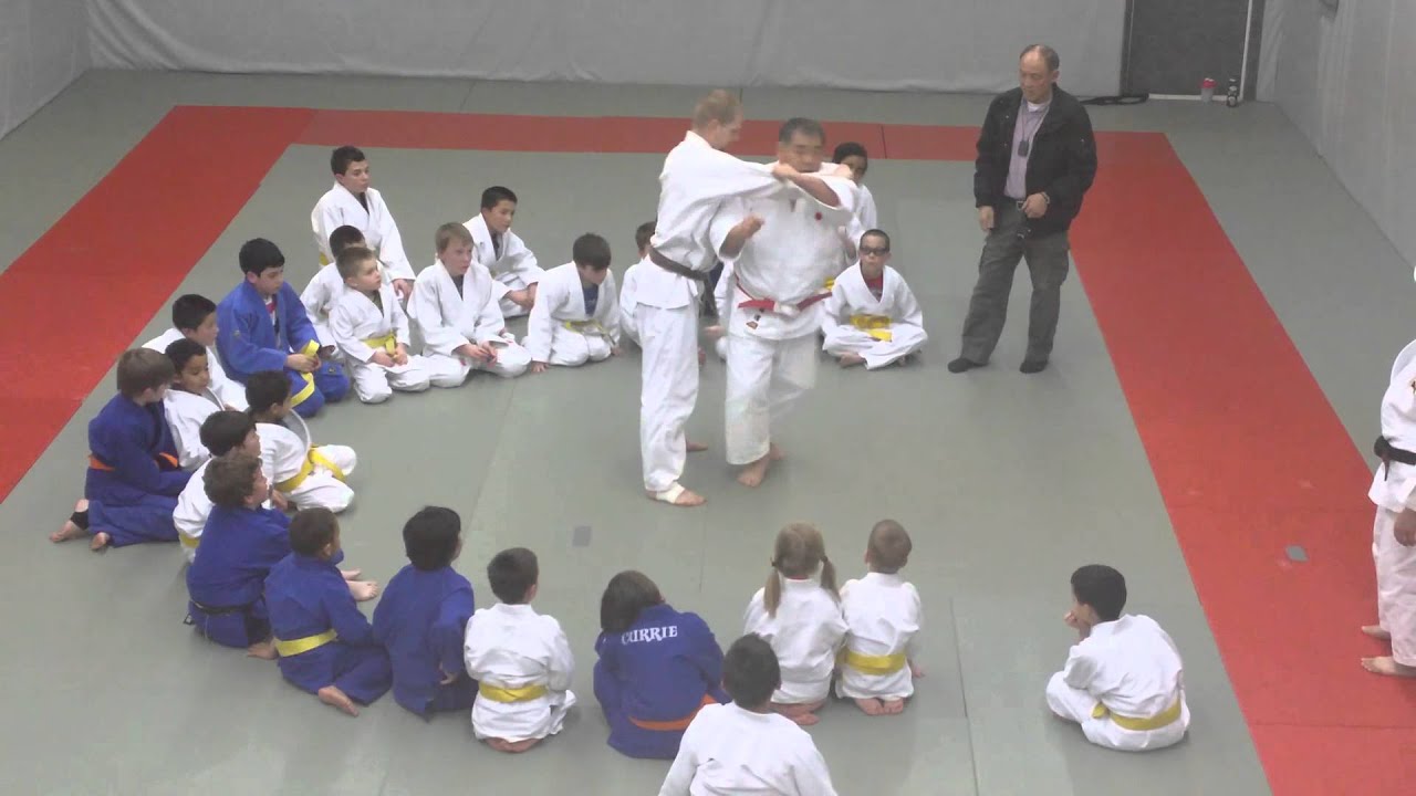 8th Dan Sensei gives a quick lesseon to the young fighters at St Albert Judo Club
