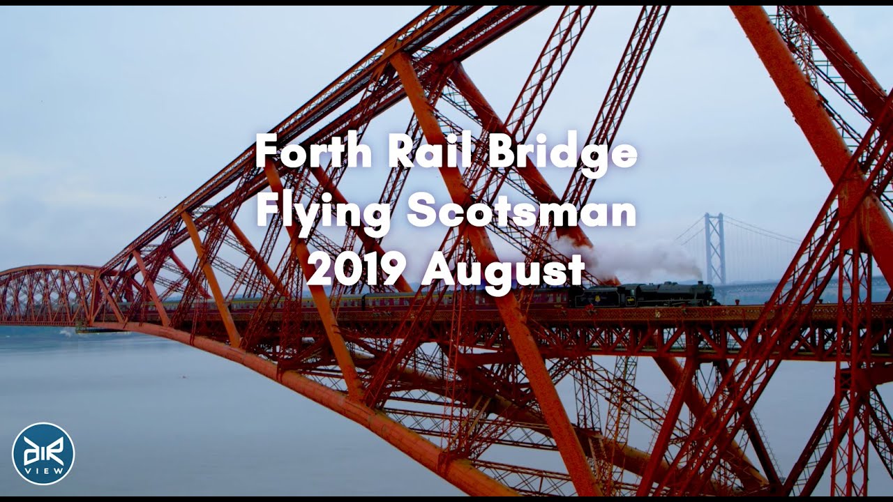 Scotland from above. Drone video 4K. Forth Rail Bridge, Flying Scotsman train passing.