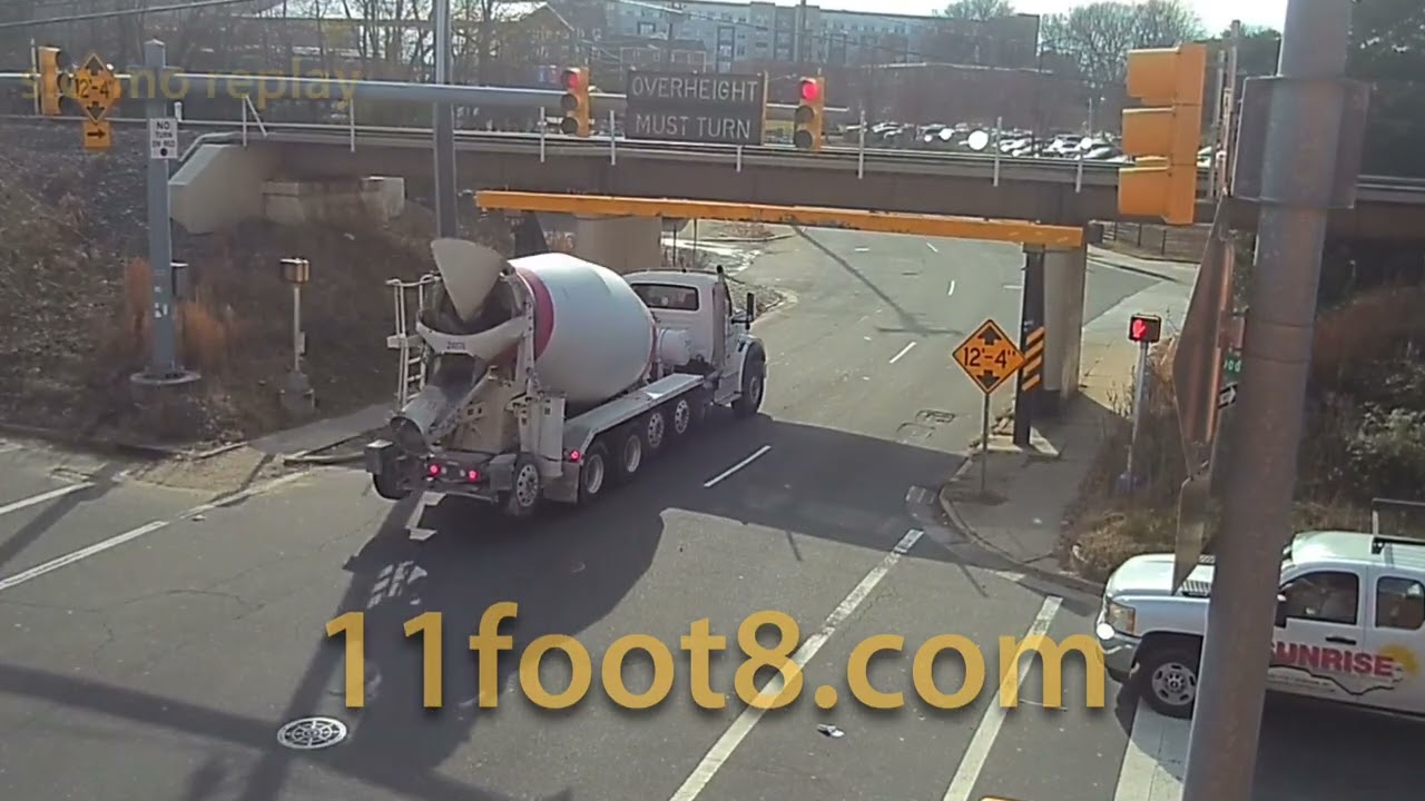 Concrete truck bounces crash beam at the 11foot8+8 bridge