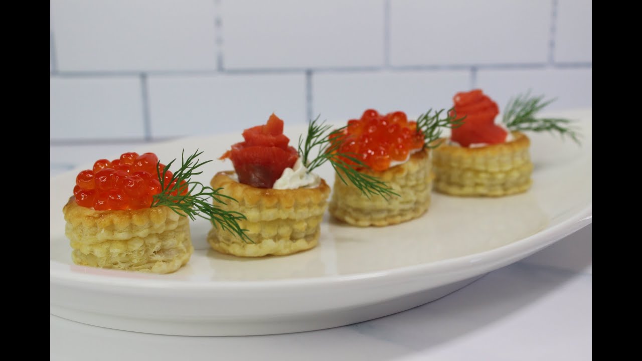 Vol-au-vent/Volovans/Puff pastry cases filled with cream cheese, red caviar and smoked salmon.