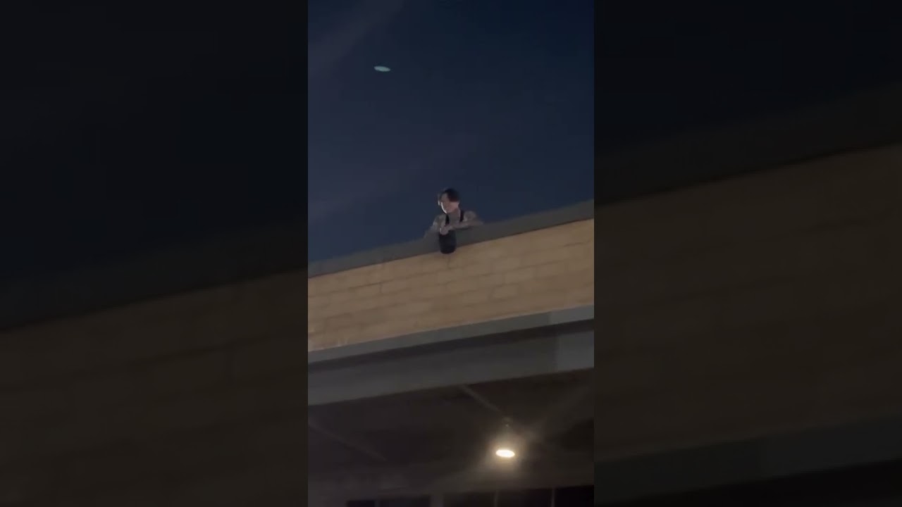 Noah Sebastian from Bad Omens singing with fans on rooftop after concert on 11-7-22
