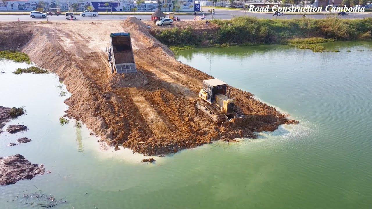 Challenging Slope Conditions: Bulldozer Operator Spreading Soil on Slop Water Part6