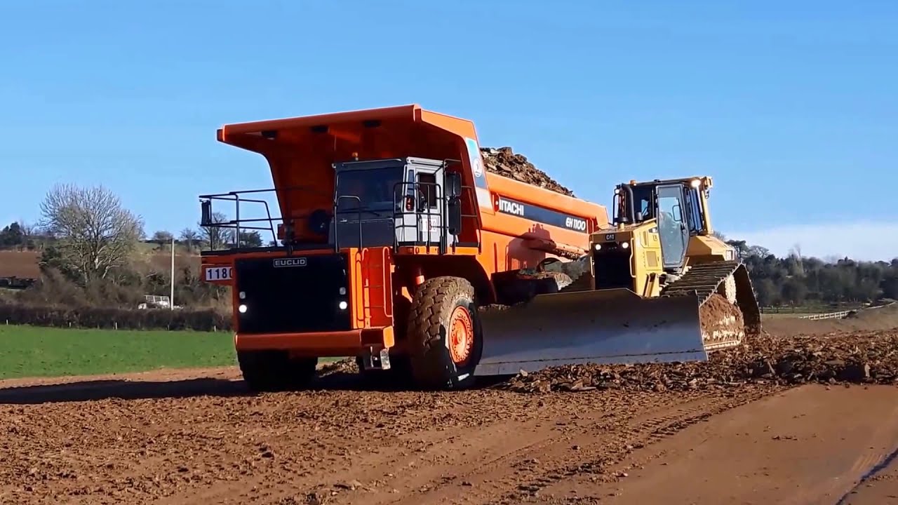 CAT D6 dozer at work pushing gravel for road construction (part 2)