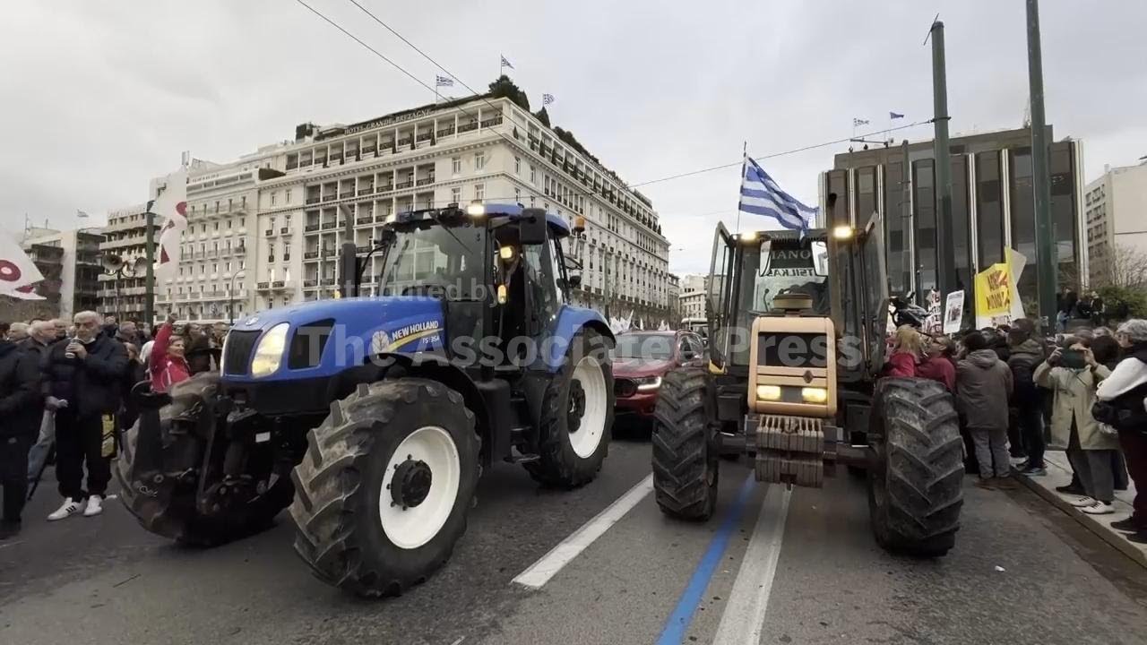 Angry Greek farmers converge on Parliament in Athens with tractors in overnight protest rally