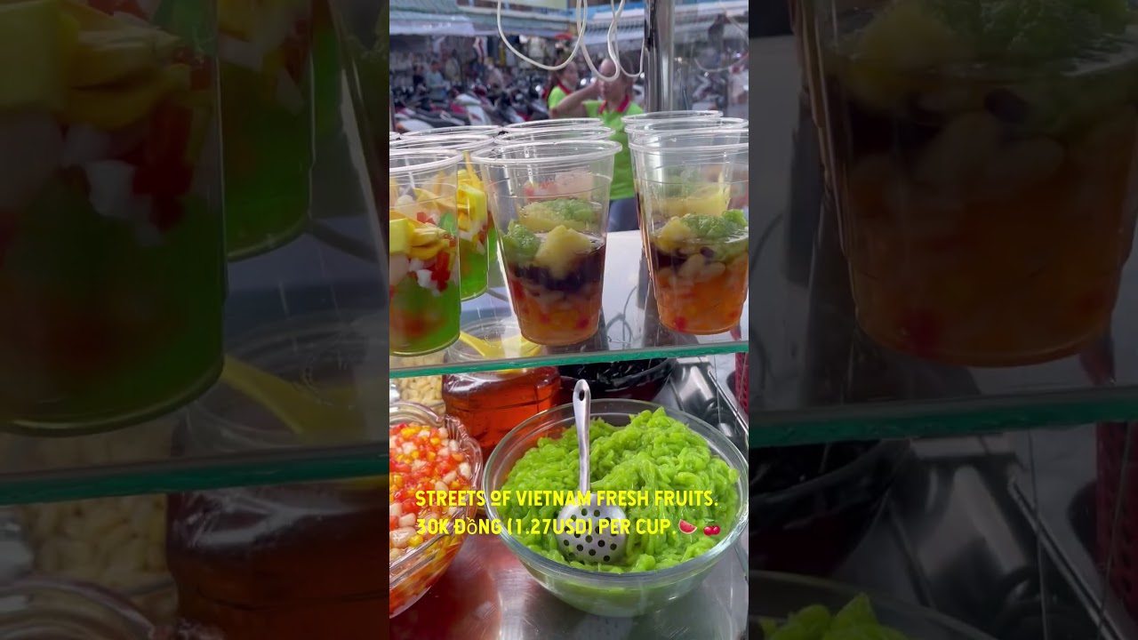 Streets of Vietnam Fresh Fruits. 30K đồng (1.27usd) per cup.🍉🍒