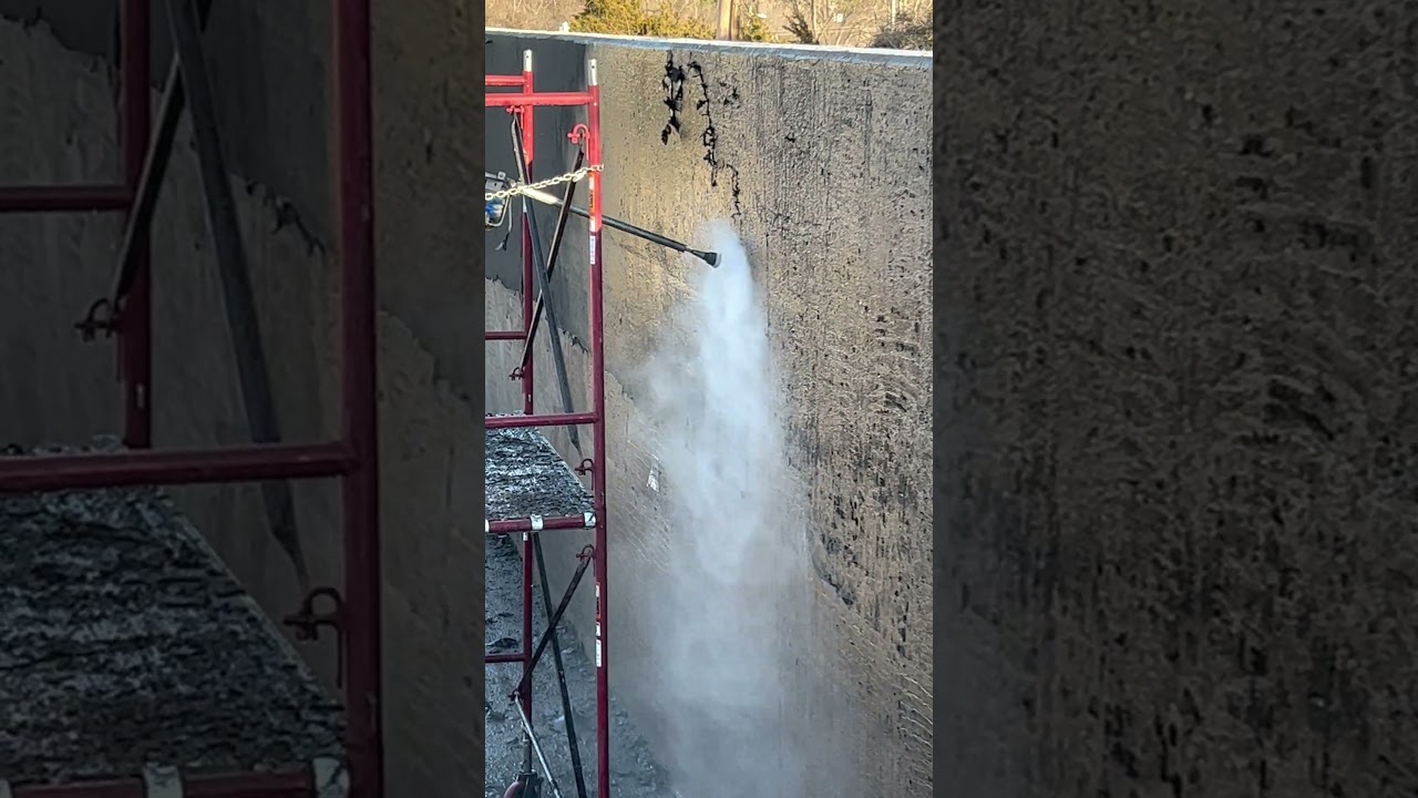 TMI MAN using 20,000 PSI water blasting to remove old coatings from a concrete clarifier.