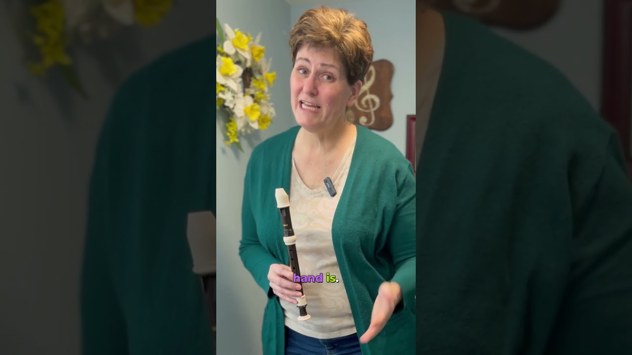 Teaching kids recorder with the correct hand on top