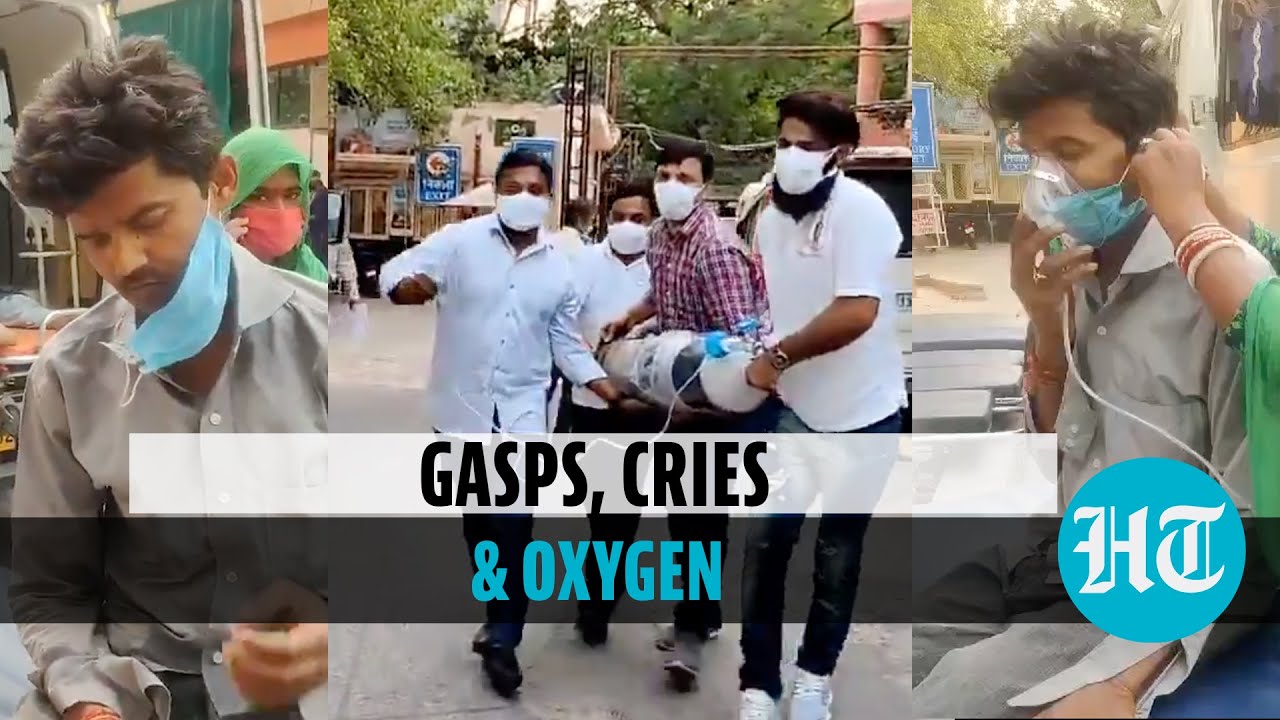 Watch: Man gasps for breath outside Delhi hospital, wife & son search for oxygen