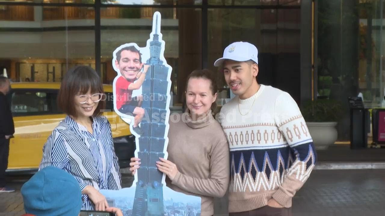 Fans react as rain delays Alex Honnold's climb of Taipei 101 skyscraper by 24 hours