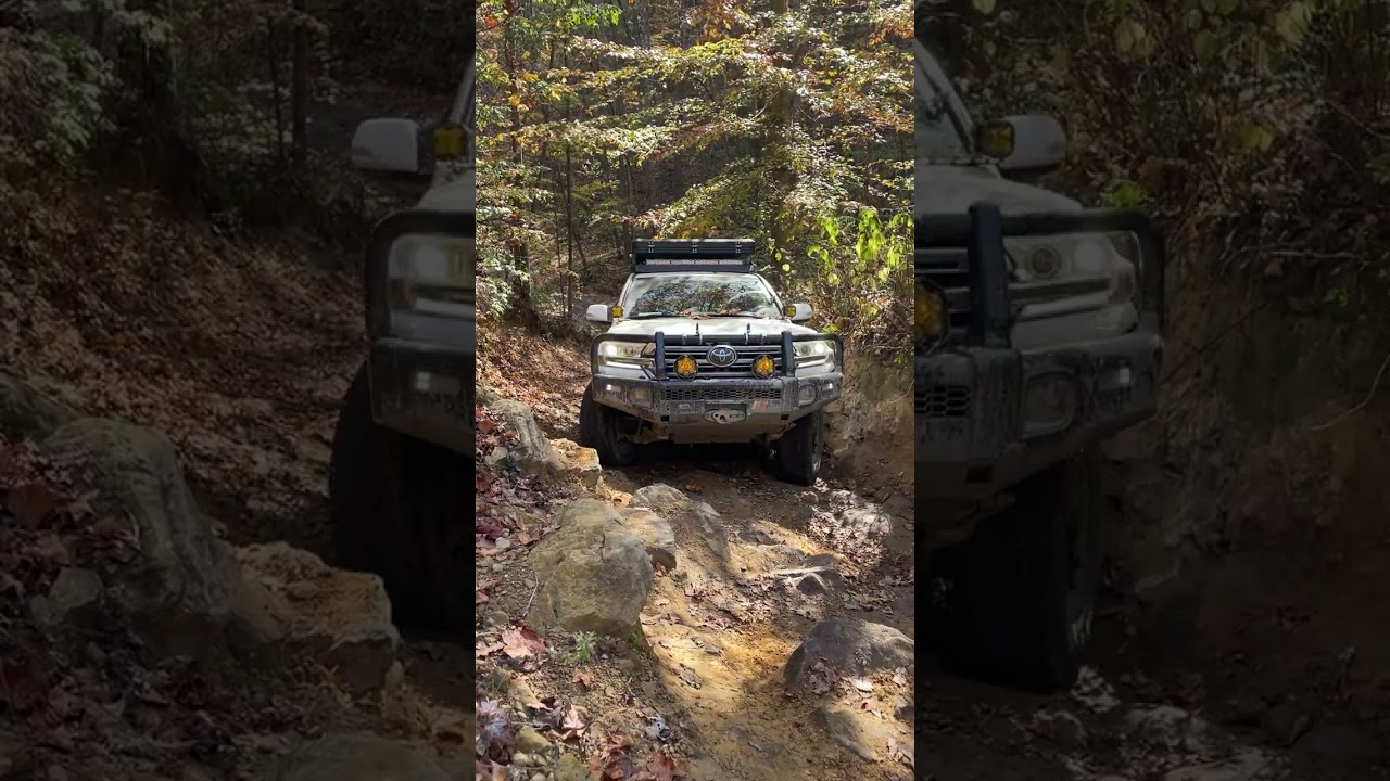 Unlocked 200 Series Land Cruiser climbs a hill on trail 26
