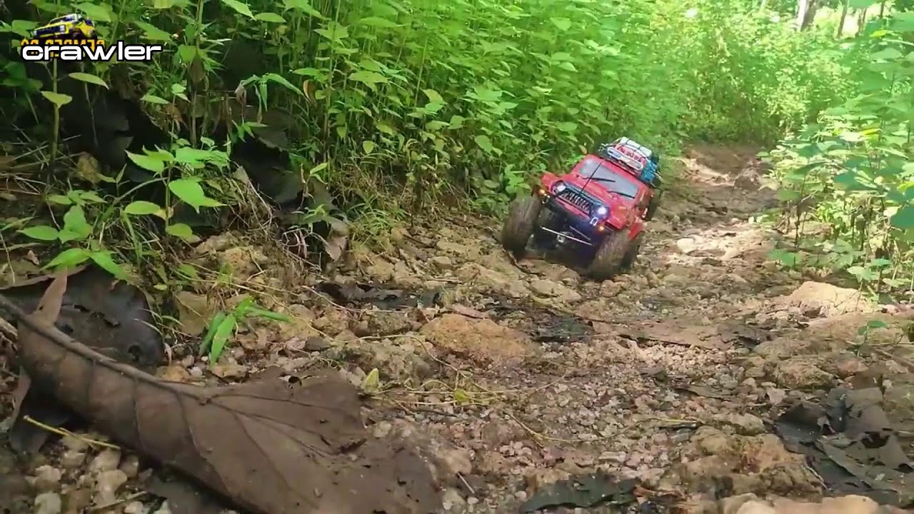 Mud, Power, and Grit: Red RC Car Takes Off-Road to the Extreme 9