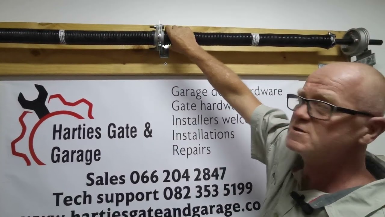 How does a torsion spring garage work