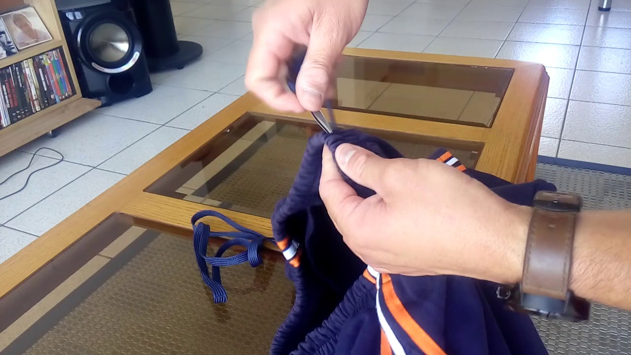 Como colocar cordón a pantalon corto o buzo deportivo.