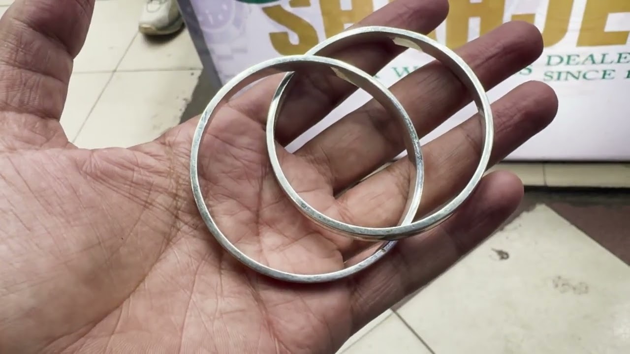 Tiffany and co bangle and omega watch at Shah jee Rolex dealer since 1988 03002286651 contact us