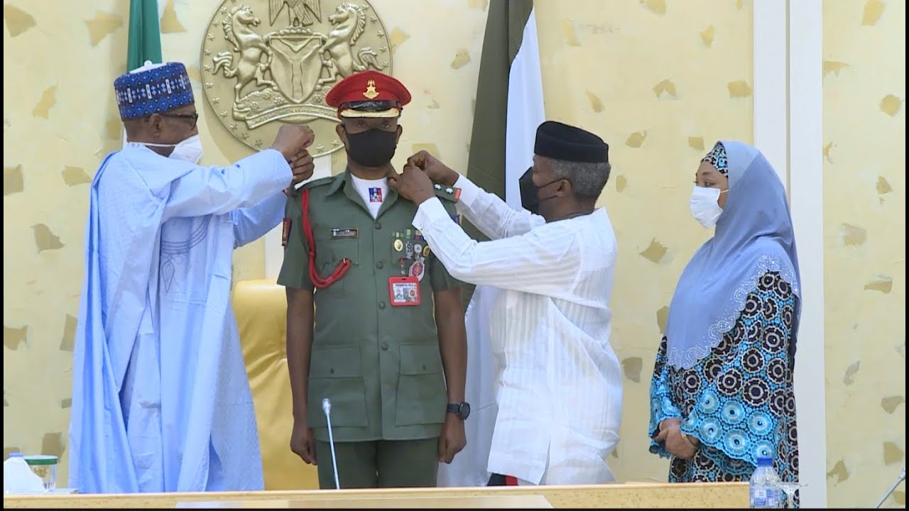 President Buhari Decorates His Aide De Camp Colonel Y.M Dodo Along With Vice President Yemi Osinbajo