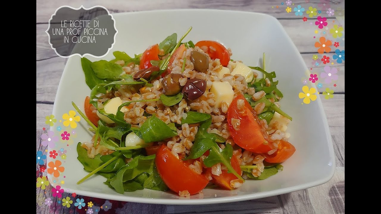 Insalata di farro con rucola, taleggio, pomodorini e olive