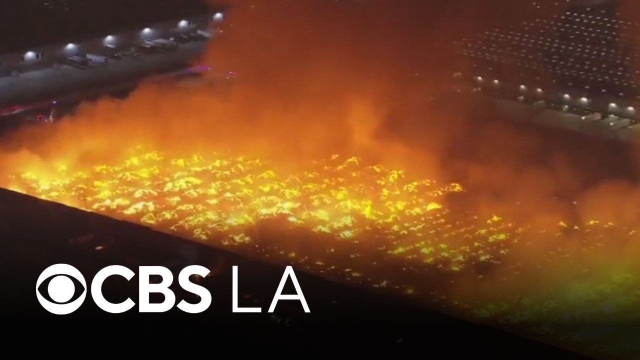 Crews battle massive warehouse fire in Ontario