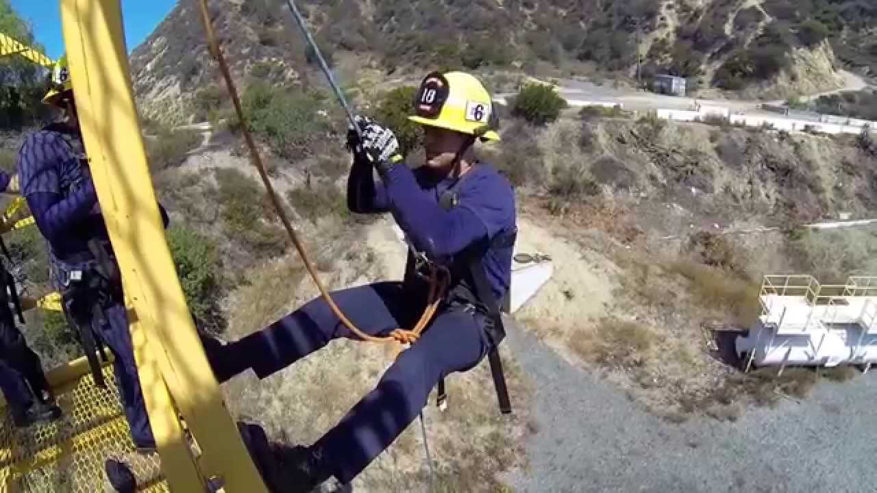 Rappelling 60ft. tower with a figure eight plate.