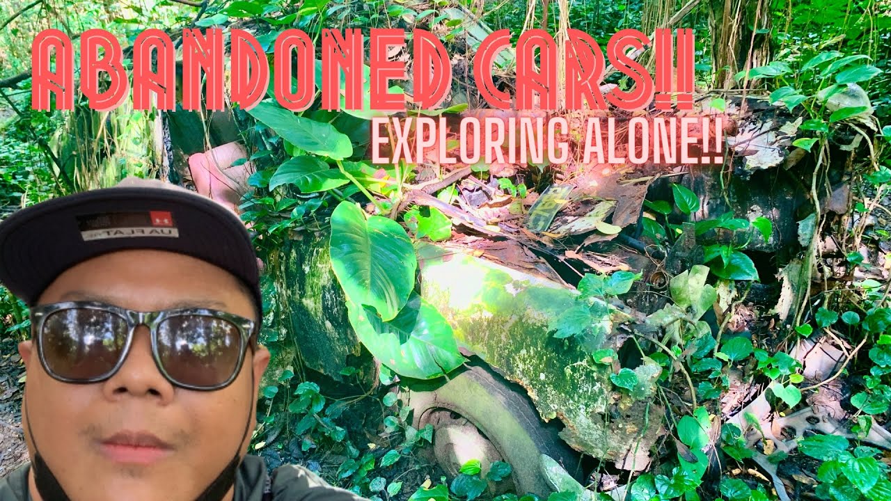 Exploring alone! Ghost Driver driving an Abandoned Car in a Singapore Forest within an old Cemetary