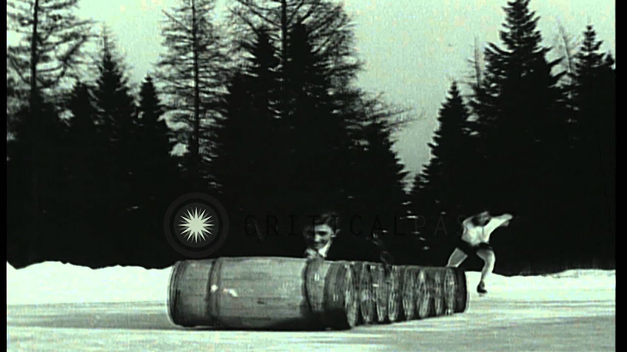 Barrel champion T Karl Milne performs jumps over barrels on ice. HD Stock Footage