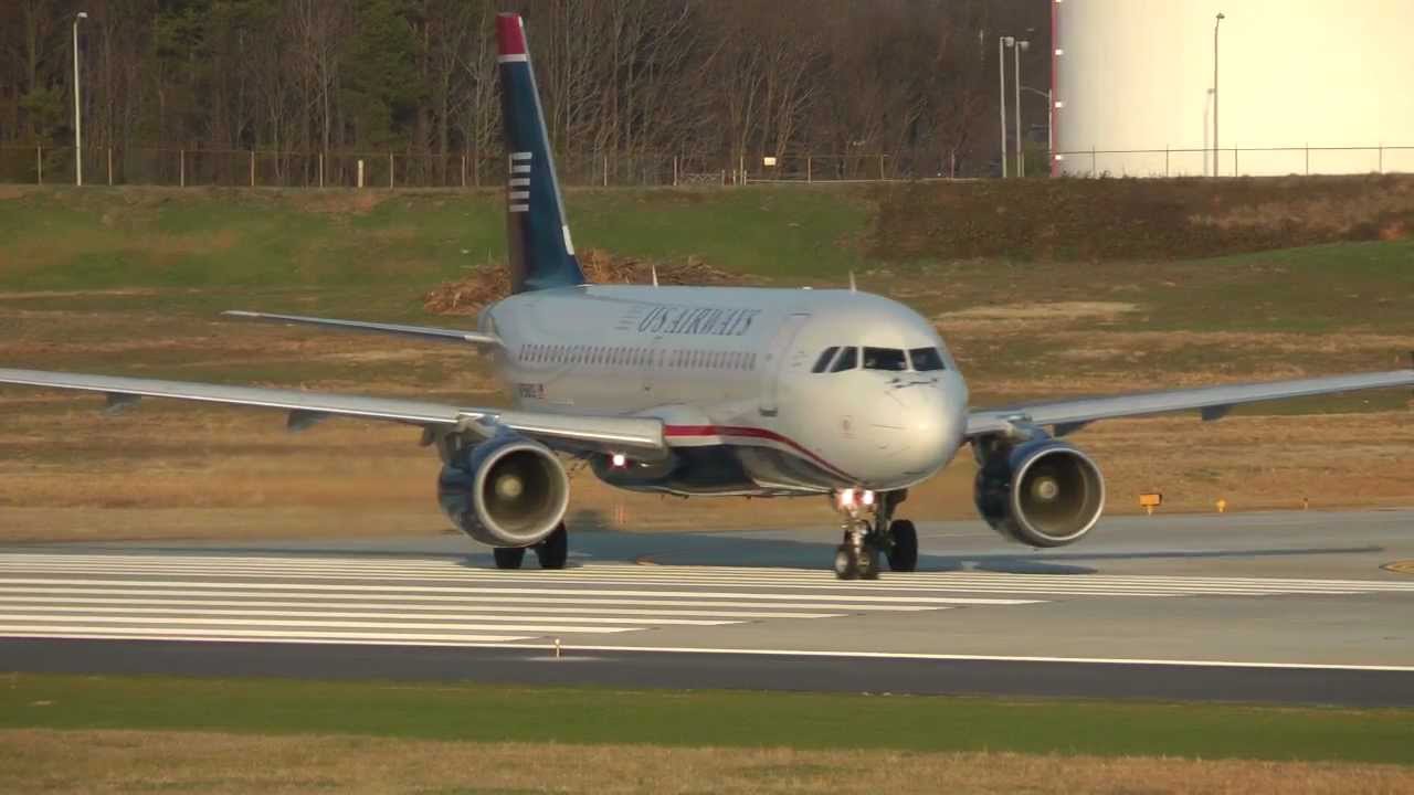 US Airways Airbus A319-112 and Embraer 170-200LR taking off at CLT