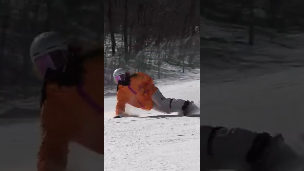Girl's powerful snowboarding.