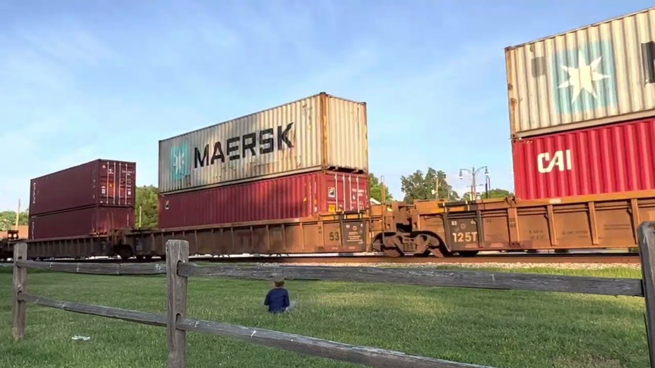 The CSX Mainline. 3 engine freight train with double stacks.