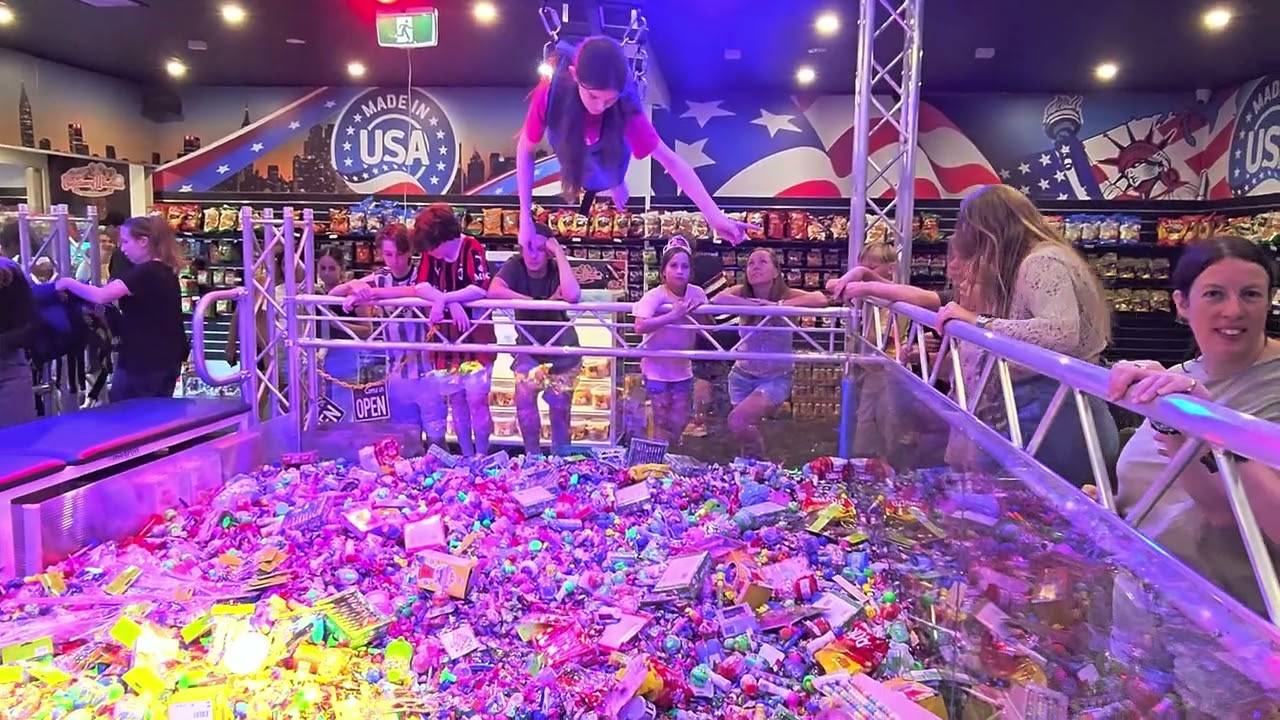 Harper on the human claw machine at toms confectionery warehouse. 1st feb 2025.