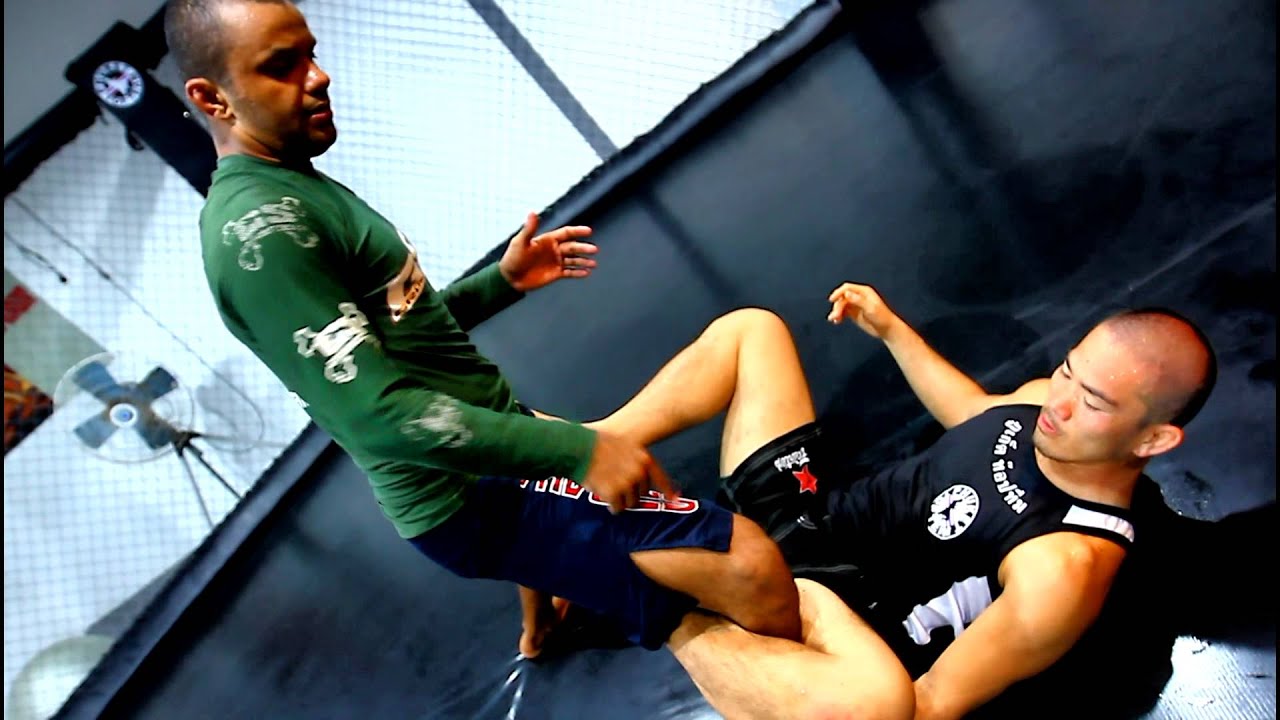 Phuket Top Team Black Belt Rodrigo Praxedes shows counter to the De La Riva with a slick Calf Crush