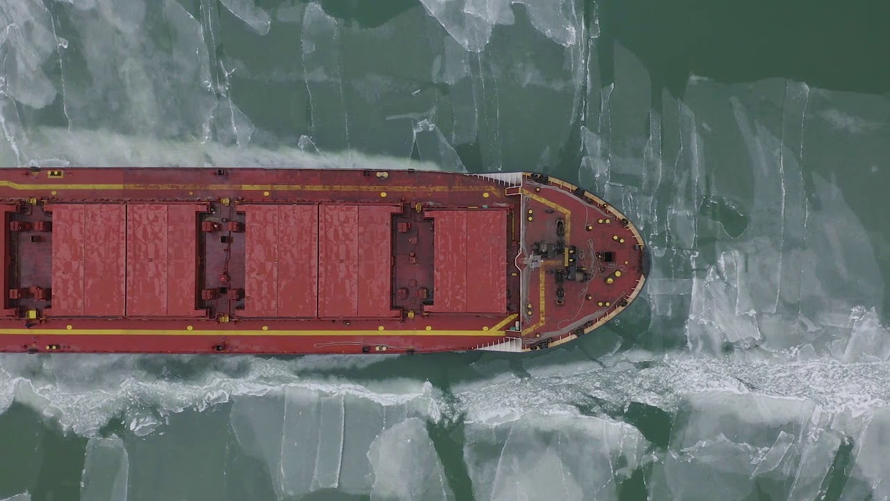 Arctic Shipping: AN AERIAL VIEW OF A CARGO SHIP MOVING THROUGH ICE