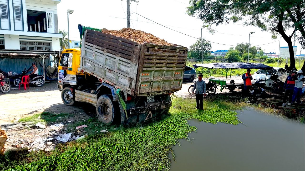 Starting NEW Local project landfill flooded Area by dump truck unloading And Bulldozer pushing