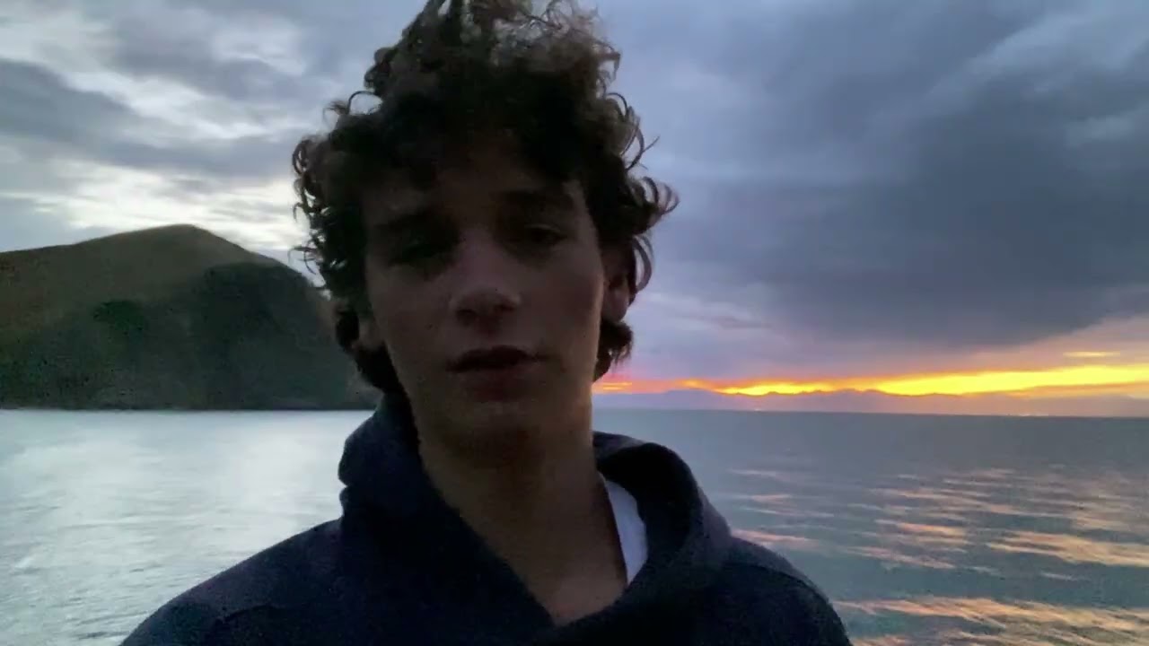 Meditating And Watching The Sunset At The Beach