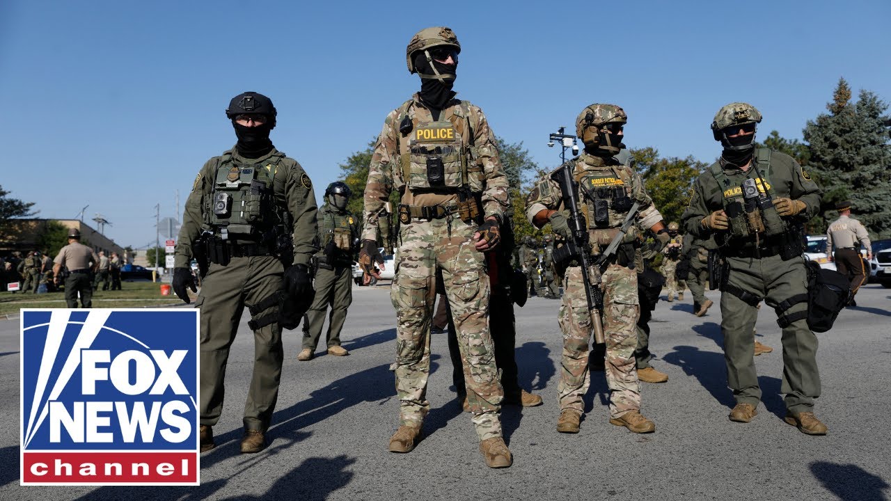 BREAKING: Armed driver rams car into federal agents