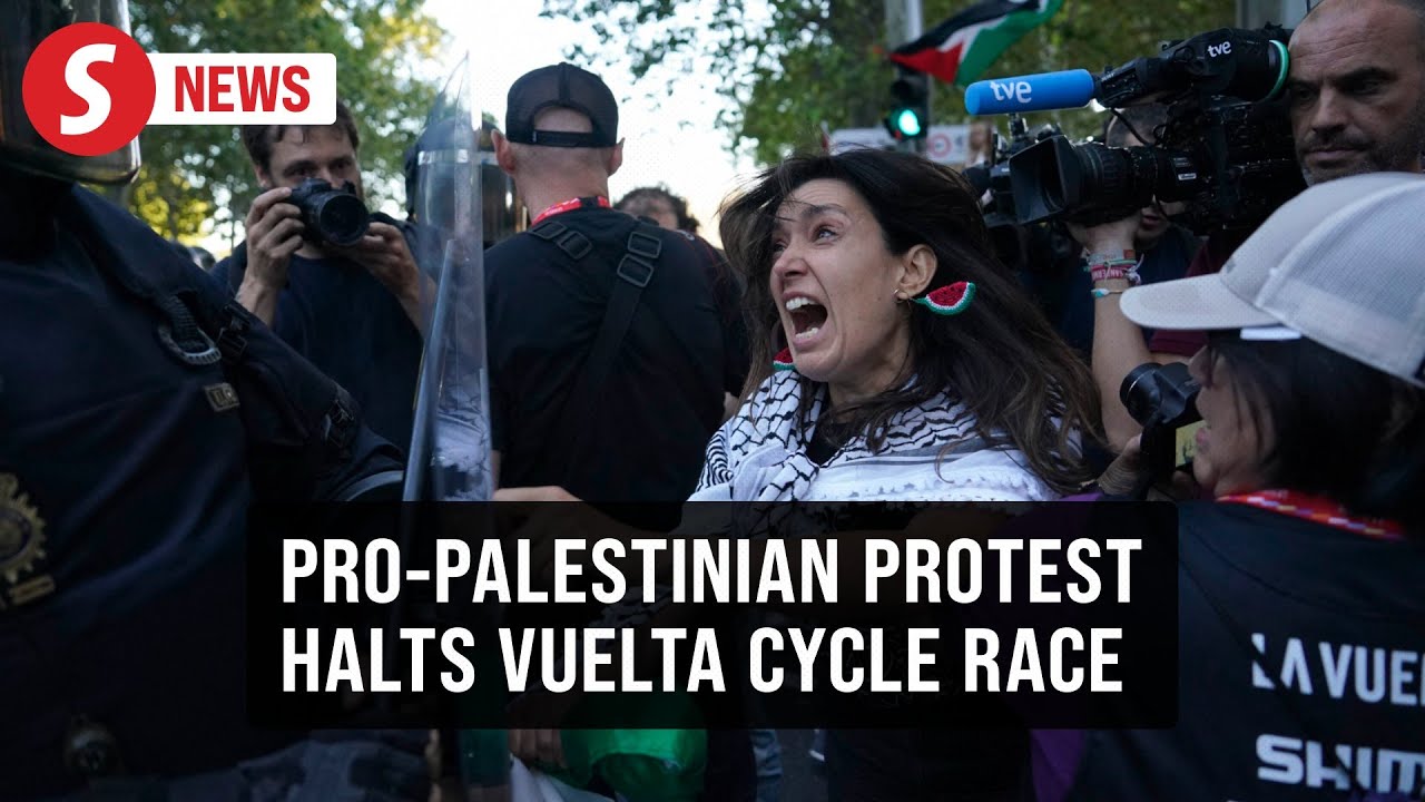 Pro-Palestinian protesters clash with police, force early end to Vuelta cycle race