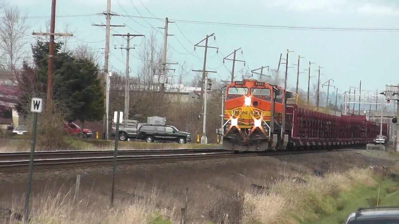 Ribbon Rail Train BNSF & Fast Amtrak Cascades passing it.