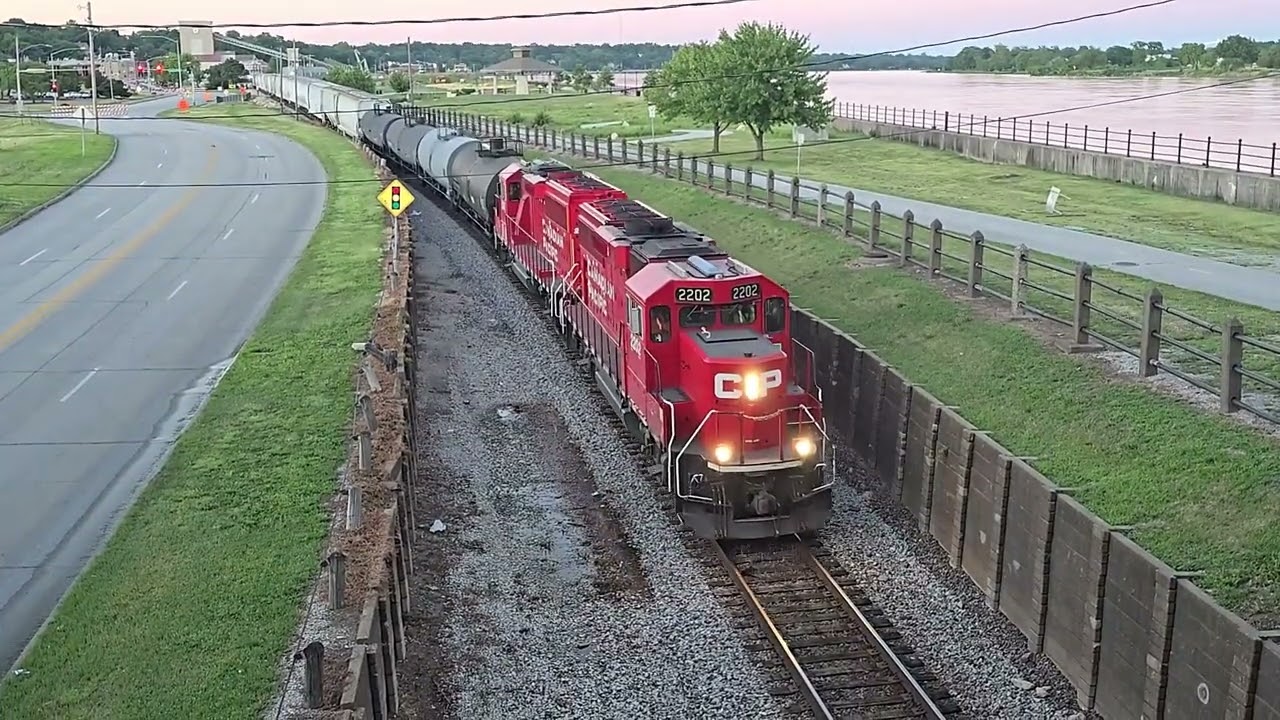 A Canadian Pacific Freight Train Passing Thru Downtown Davenport, Iowa Along The Mississippi River