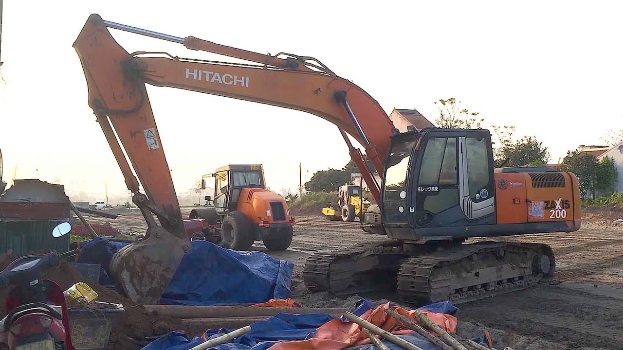 Excavator and dump truck in operation.