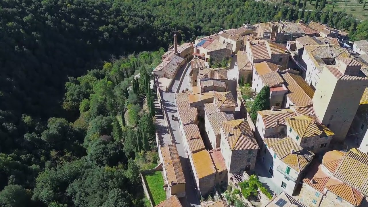 Relaxing aerials over Tuscan hill towns Petroio and Castelmuzio
