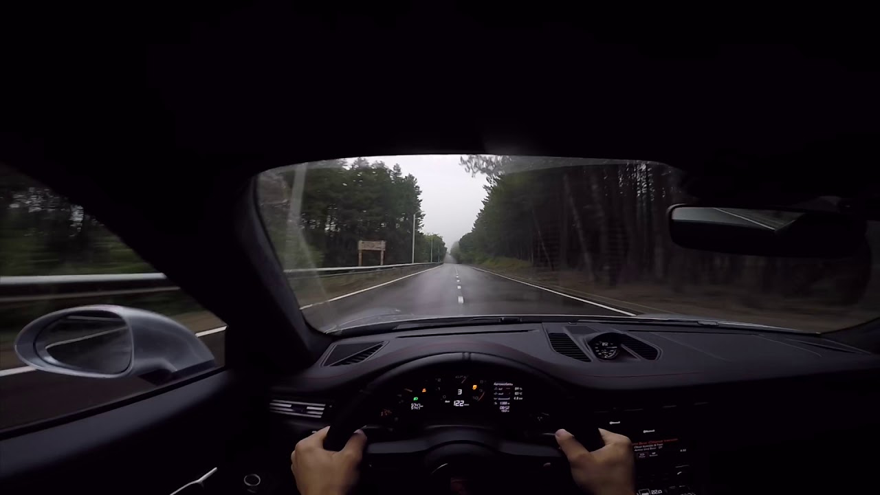 Porsche GT3 Touring. Driving in mountains. Very wet.