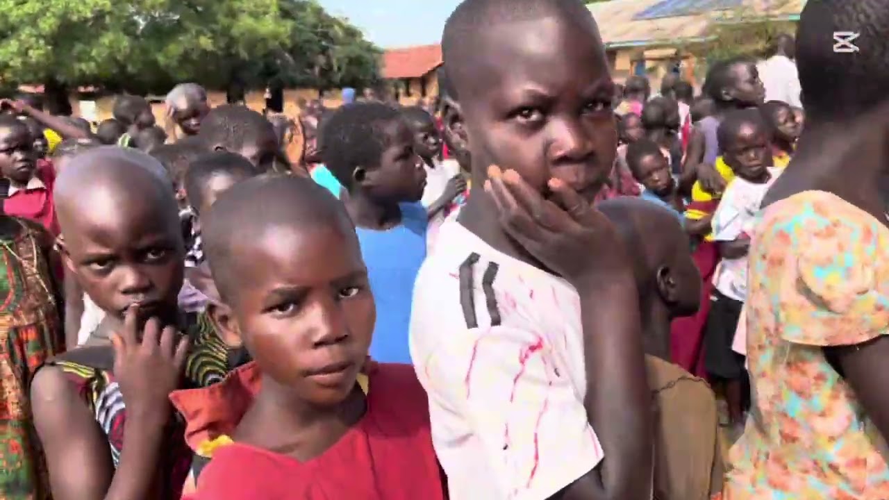 African Nyako Foundation/ Giving Out Books to The Village Children At School 