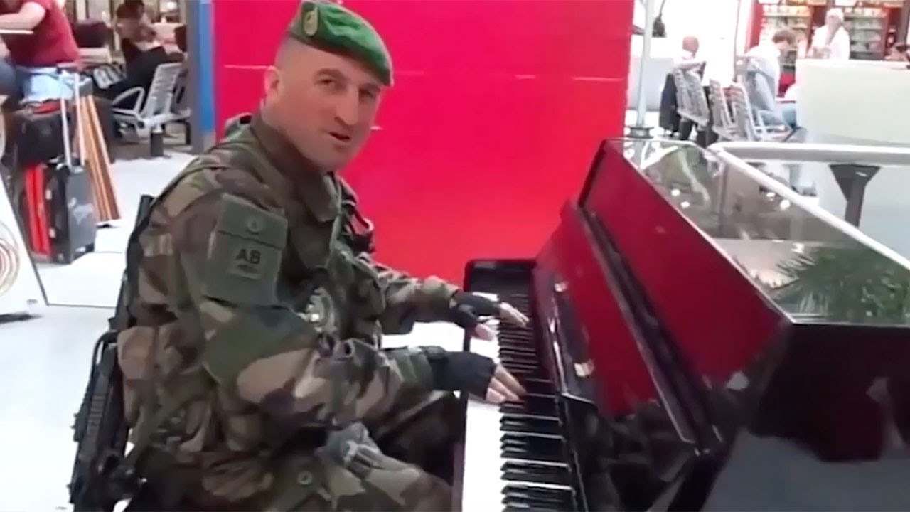 French Soldier Plays Piano And Sings At Train Station