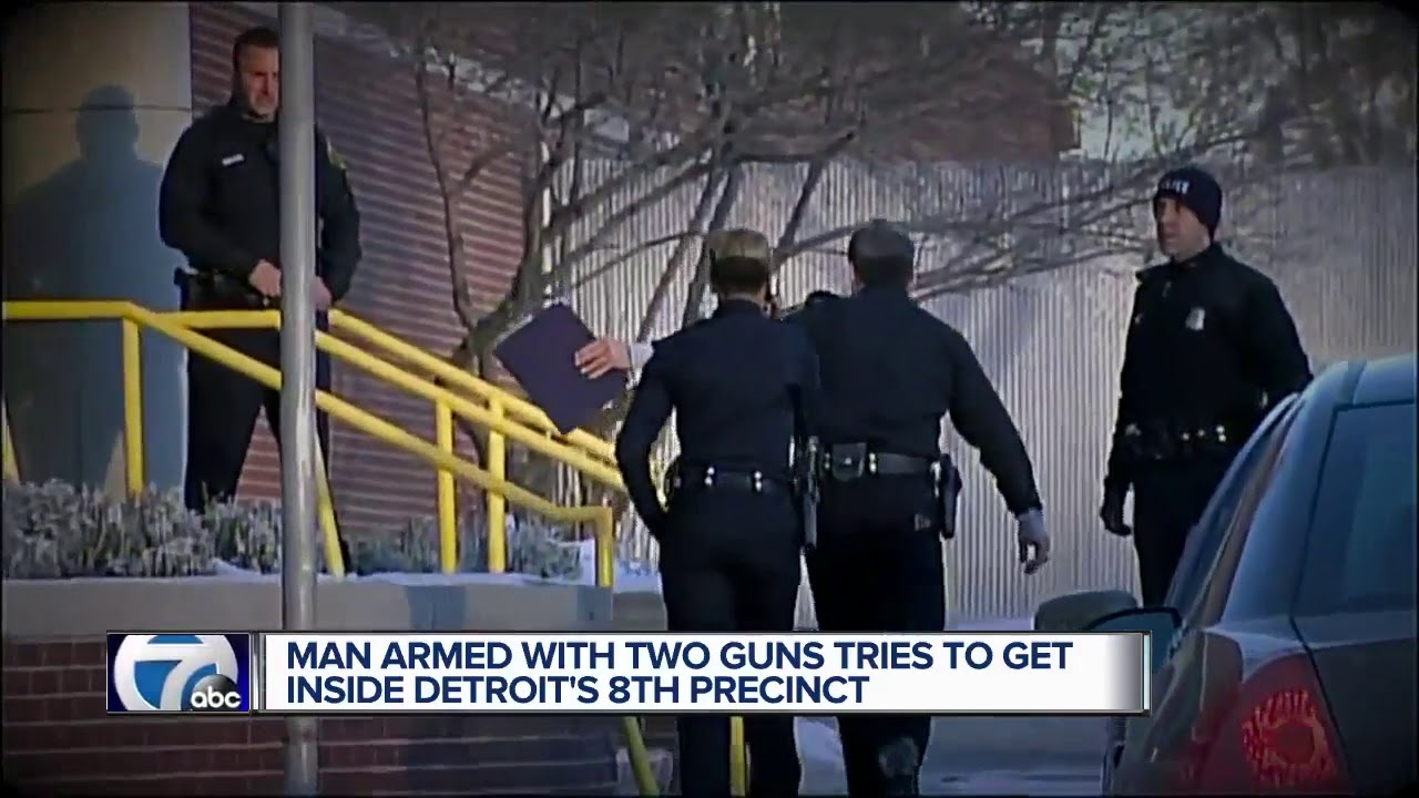 Man brandishing two guns tries to get into police precinct, woman drives him to hospital for help