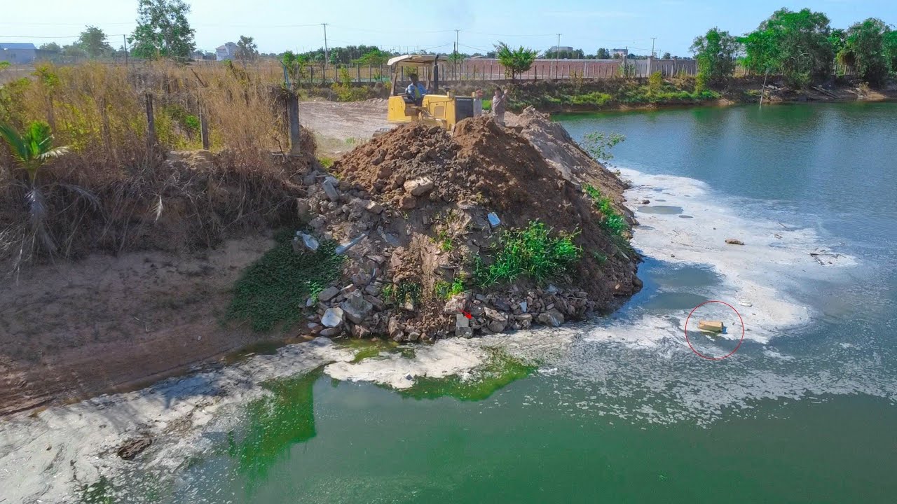 First Opening New Project Landfill delete pond using stone rock KOMATSU D31P with 10Ton truck