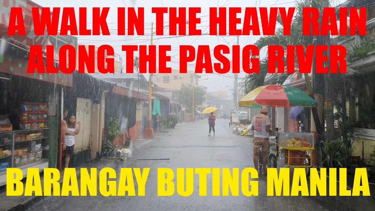 A WALK IN HEAVY RAIN ALONG THE PASIG RIVER IN MANILA