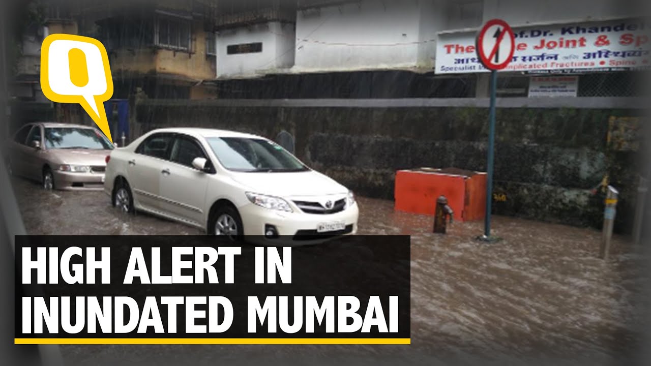 The Quint: Inundated Mumbai Disrupts Normal Life; High Tide Alert at Juhu