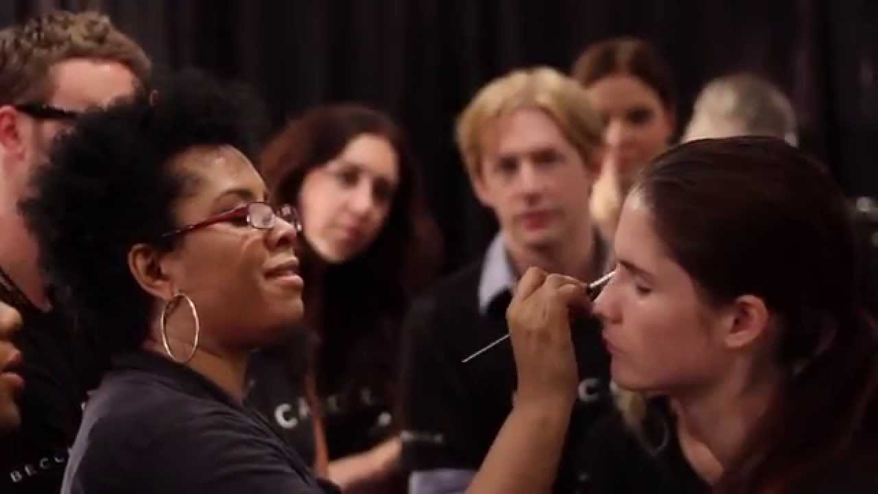 DeShawn Hatcher Makeup Artist backstage at  SS 2012 Venexiana