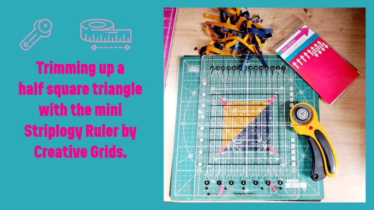 Trimming up half square triangles with the Creative Grids mini Stripology Ruler.