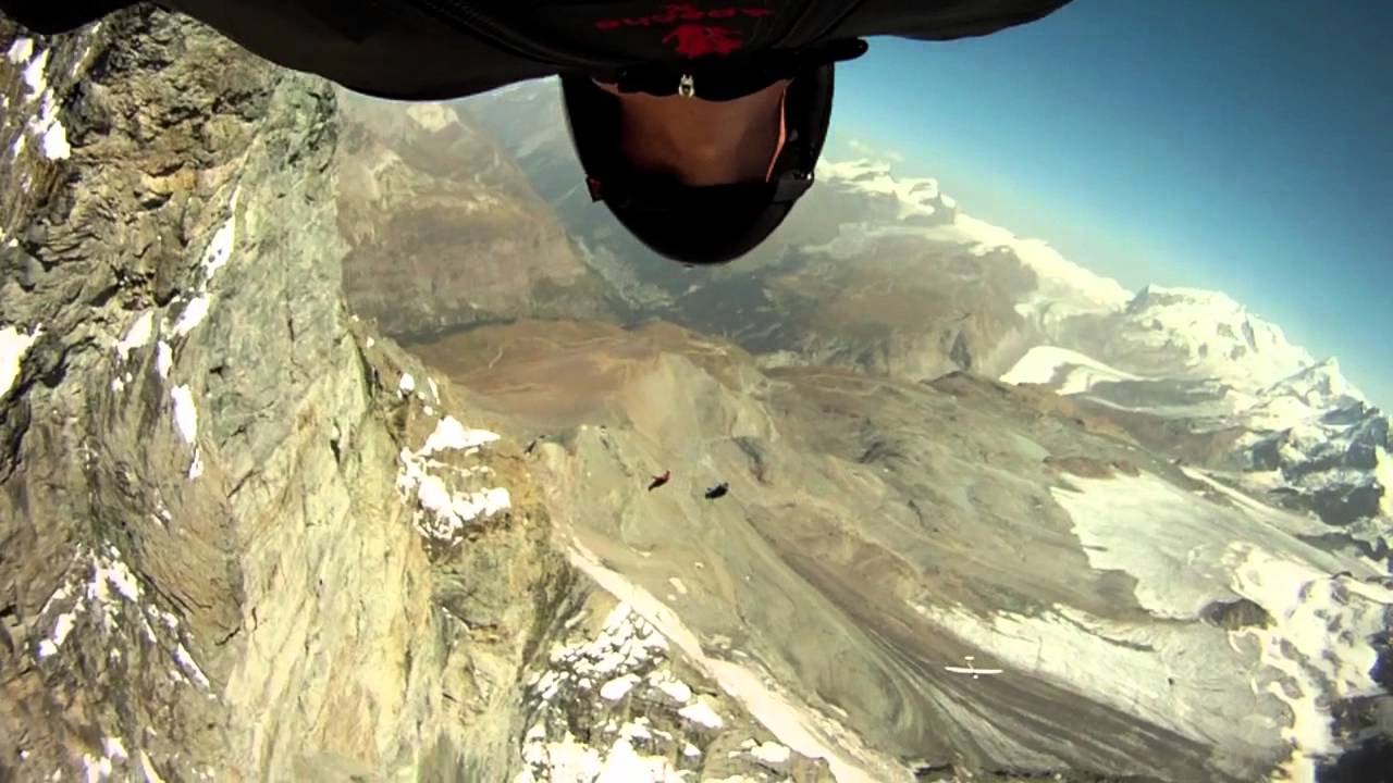 Joby Ogwyn, Jeb Corliss and Jeff Nebelkopf fly around the Matterhorn