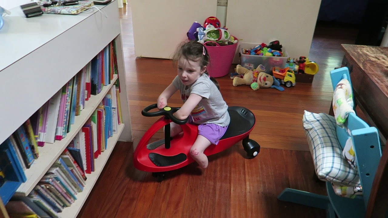 Mia zooming around on her plasma car
