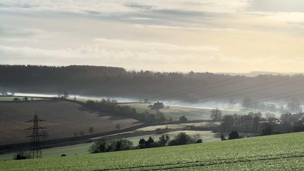 No talk, countryside views, train in distance, low cloud, church scene. Relaxing view, nature